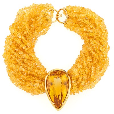 Lot 2143 - Seventeen Strand Tumbled Citrine Bead, Gold and Citrine Torsade Necklace