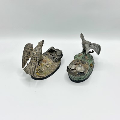 Lot 236 - Two Painted Cast Iron "Eagle and Eaglets" Banks