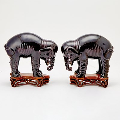 Lot 21 - Pair of Chinese Aubergine Glazed Porcelain Elephants