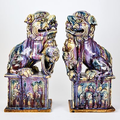 Lot 639 - A Pair of Chinese Flambe Glazed Porcelain Lions