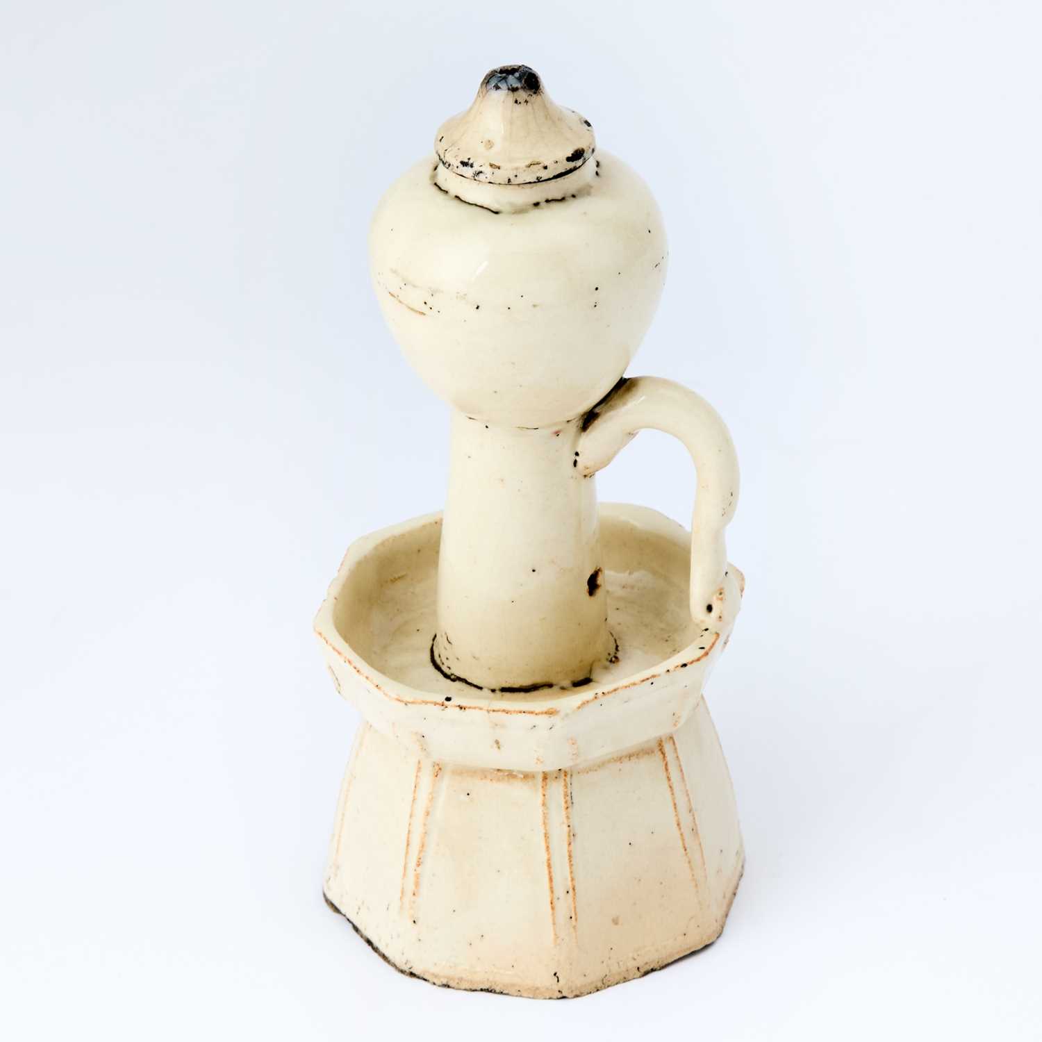 Lot 178 - A Chinese Earthenware Oil Lamp and Cover
