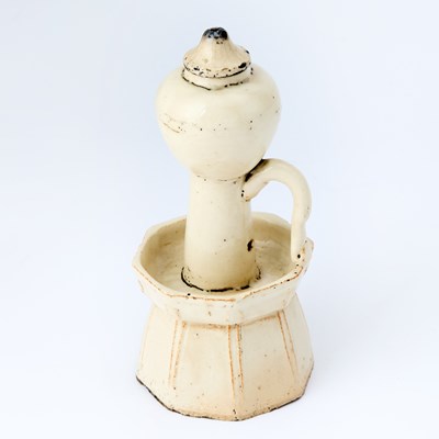 Lot 178 - A Chinese Earthenware Oil Lamp and Cover
