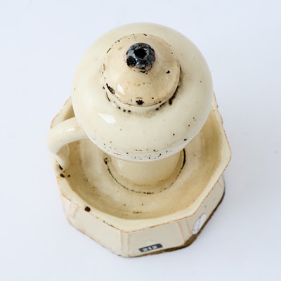 Lot 178 - A Chinese Earthenware Oil Lamp and Cover