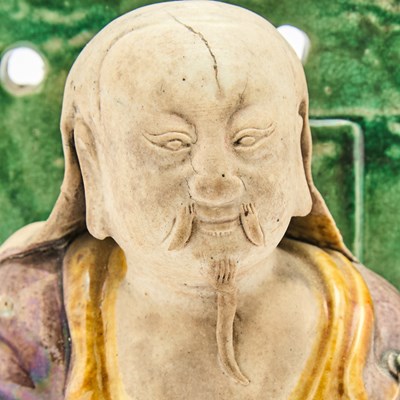 Lot 618 - A Chinese Sancai Glazed Pottery Figure of Chen Wu