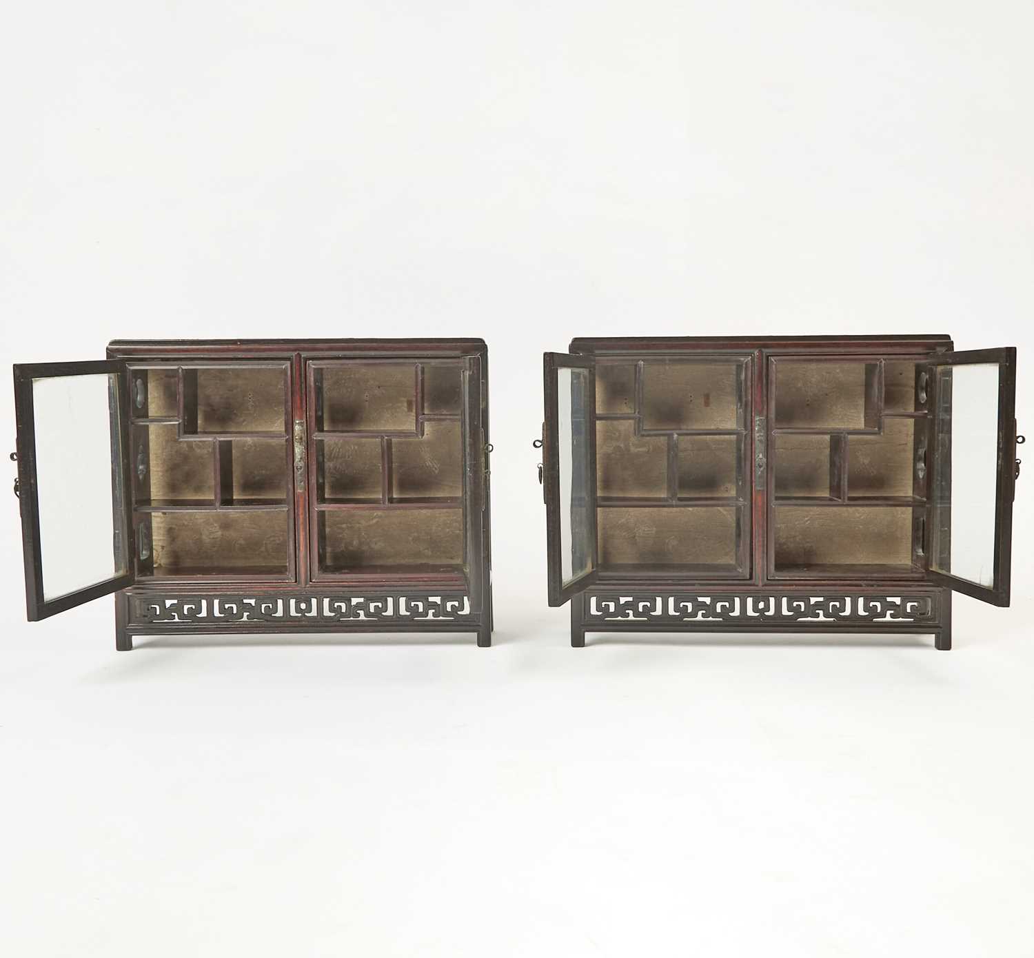 Lot 606 - A Pair of Chinese Hardwood Collector’s Cabinets