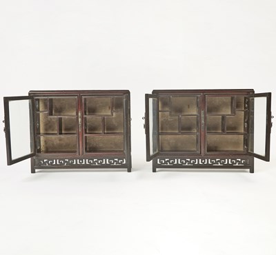Lot 606 - A Pair of Chinese Hardwood Collector’s Cabinets