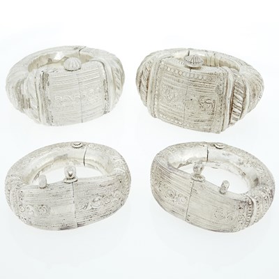 Lot 391 - Four Oversized Mixed Metal Bangle Bracelets