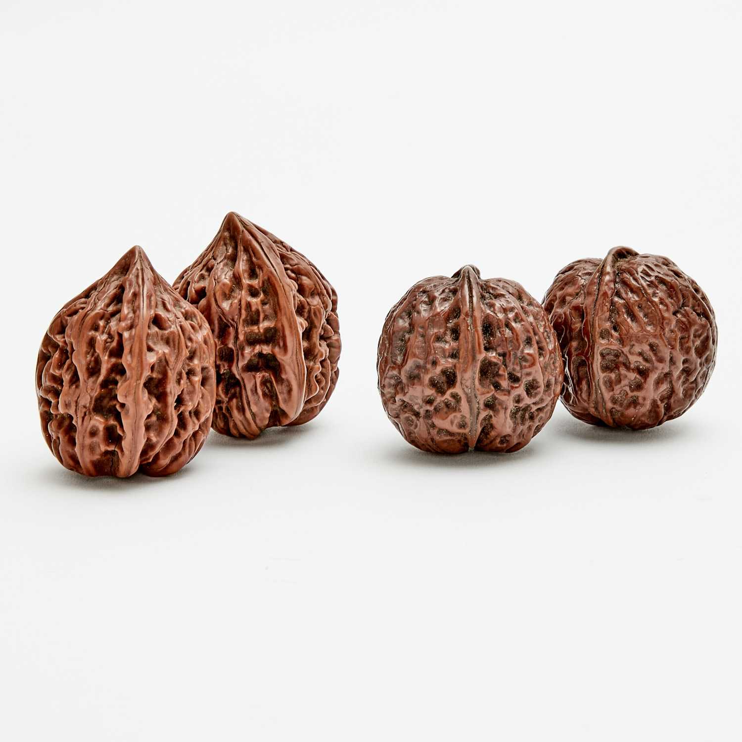 Lot 568 - Two Pairs of Chinese Carved Walnut Shells