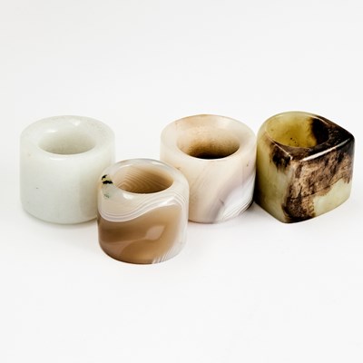 Lot 38 - Four Chinese Hardstone Thumb Rings