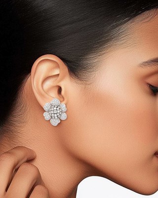 Lot 60 - Giovane Pair of White Gold and Diamond Flower Earclips