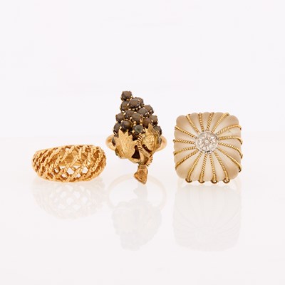 Lot 1290 - Three Gold, Diamond, Frosted Rock Crystal and Black Star Sapphire Rings