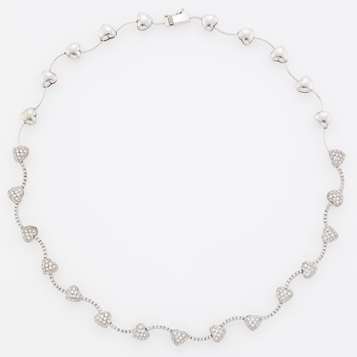 Lot 1077 - White Gold and Diamond Heart Necklace