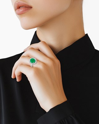 Lot 61 - Platinum, Cabochon Emerald and Diamond Ring