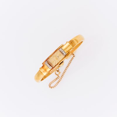 Lot 1142 - Bucherer Gold and Diamond Bangle-Watch