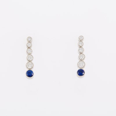 Lot 1096 - Tiffany & Co. Pair of Platinum, Diamond and Sapphire 'Jazz' Pendant-Earrings