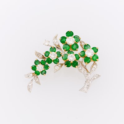 Lot 1106 - Two-Color Gold, Emerald and Diamond Flower Brooch