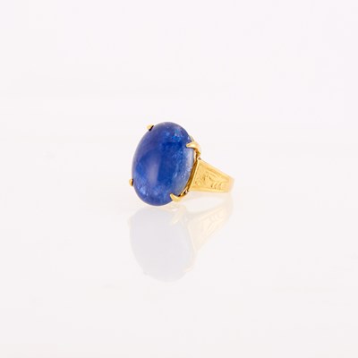Lot 1187 - Gold and Cabochon Sapphire Ring