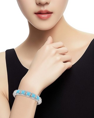 Lot 53 - White Gold, Turquoise and Diamond Bangle Bracelet