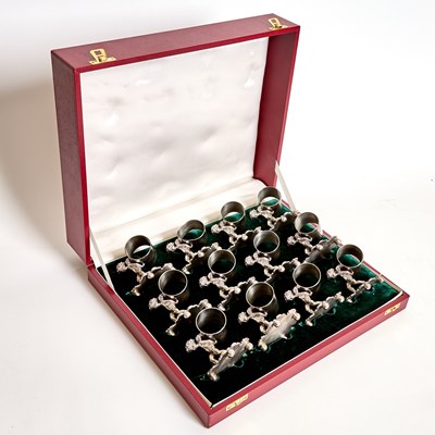 Lot 111 - Cased Set of Twelve Figural Silver Plated Napkin Rings