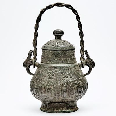 Lot 70 - A Chinese Bronze Hu Vase and Cover