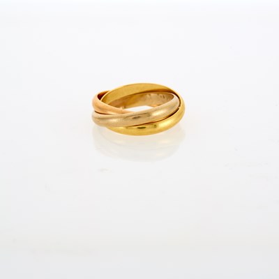 Lot 1040 - Must de Cartier Tricolor Gold 'Rolling' Band Ring, France