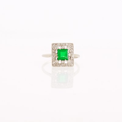 Lot 1240 - Platinum, Emerald and Diamond Ring