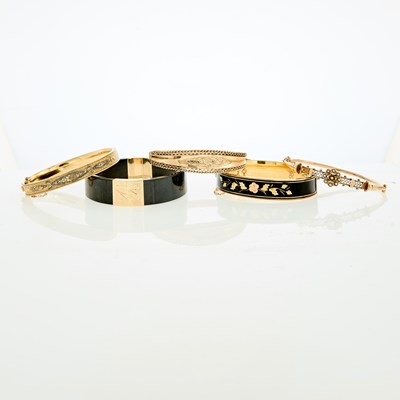 Lot 155 - Five Gold, Low Karat Gold, Gold-Filled and Black Onyx Bangle Bracelets