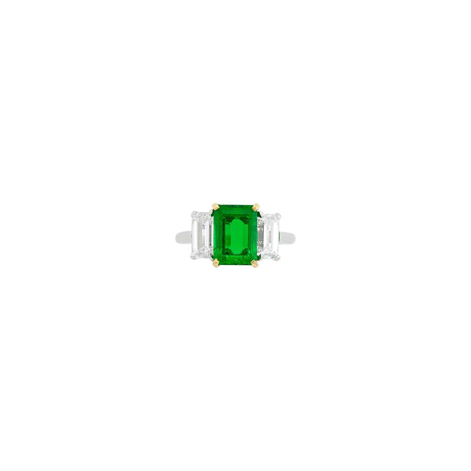 Lot 229 - Bulgari Platinum, Gold, Emerald and Diamond Ring
