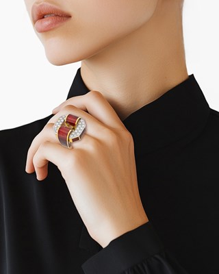 Lot 78 - David Webb Gold, Platinum, Diamond and Red Enamel Buckle Ring