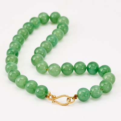 Lot 547 - A Chinese Jadeite Bead Necklace