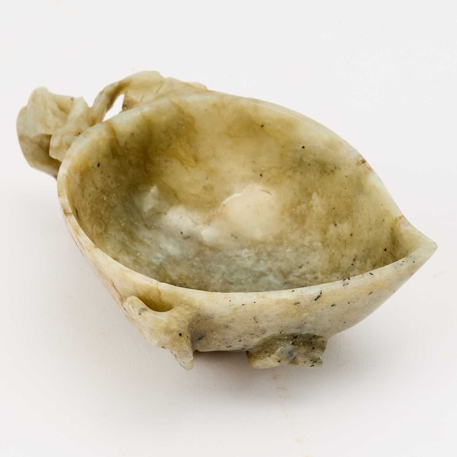 Lot 534 - A Chinese Carved Jade Washer