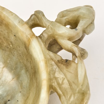 Lot 534 - A Chinese Carved Jade Washer