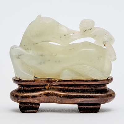 Lot 520 - A Chinese Greenish White Jade Figural Carving