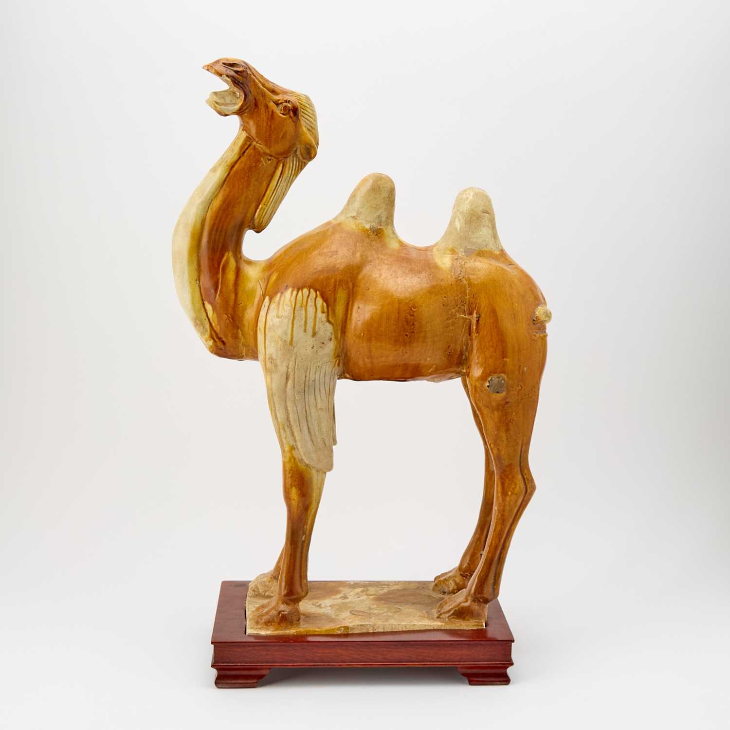 Lot 615 - A Chinese Sancai Glazed Pottery Figure of a Bactrian Camel