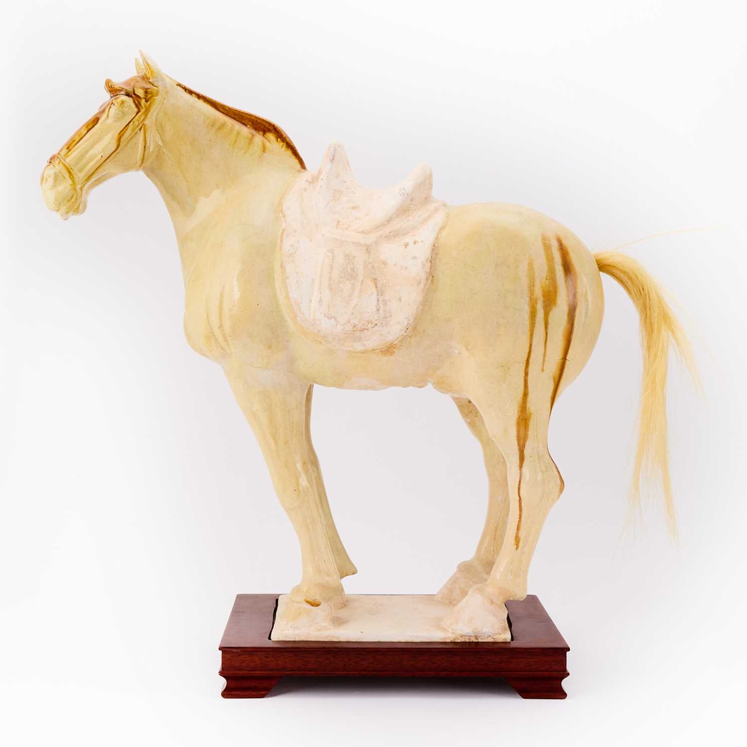 Lot 164 - A Chinese Sancai Glazed Pottery Figure of a Horse