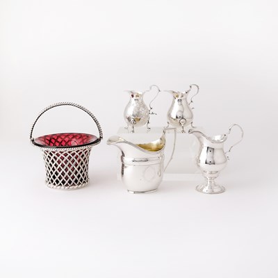 Lot 109 - Four Georgian Sterling Silver Cream Jugs and a Victorian Sterling Silver and Ruby Glass Sugar Basket