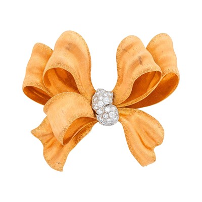 Lot 96 - Buccellati Two-Color Gold and Diamond Bow Clip-Brooch