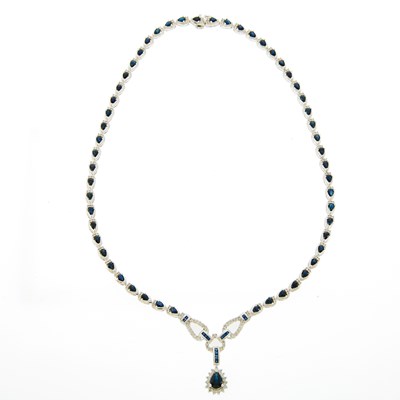 Lot 1094 - White Gold, Diamond and Sapphire Pendant-Necklace