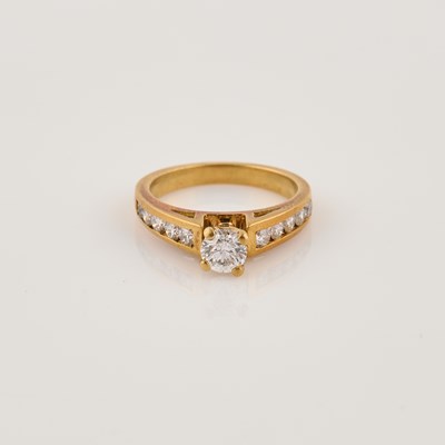 Lot 53 - Diamond Engagement Ring, 11 diamonds, center stone about 0.40 ct., 10 stones about 0.40 ct., 18K 3 dwt.