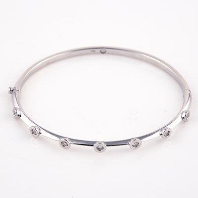 Lot 242 - Diamond Rigid Bracelet, 7 diamonds about 0.35 ct., 18K 8 dwt.