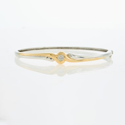Lot 53 - Two-Color Gold and Diamond Bangle Bracelet