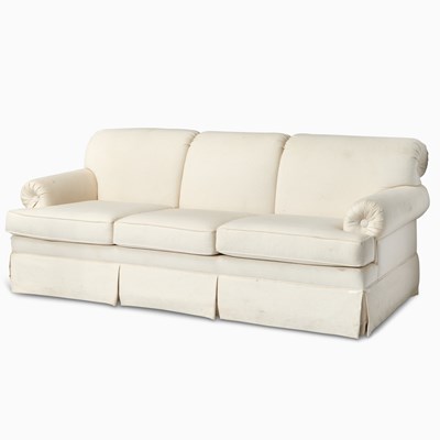 Lot 511 - Cream Colored Upholstered Three-Seat Sofa