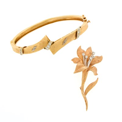 Lot 229 - Two-Color Gold and Diamond Bangle Bracelet and Flower Brooch