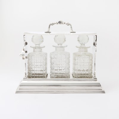 Lot 103 - Silver-Plated Tantalus with Three Glass Decanters