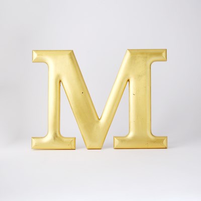 Lot 70 - The iconic screen-used wall-mounted "M" from The Mary Tyler Moore Show