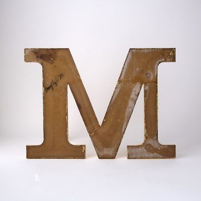 Lot 70 - The iconic screen-used wall-mounted "M" from The Mary Tyler Moore Show
