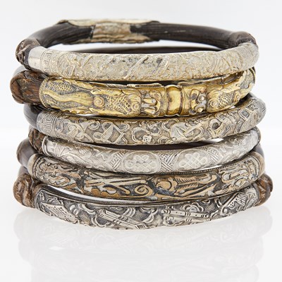 Lot 13 - Group of Wood and Metal Bangle Bracelets