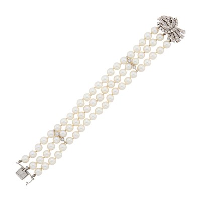 Lot 2149 - Triple Strand Cultured Pearl, White Gold and Diamond Bracelet