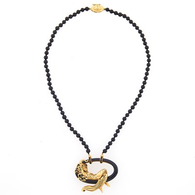 Lot 2180 - Erte, Circle of Fine Arts Gold and Black Onyx 'Femme Endormie' Pendant-Necklace