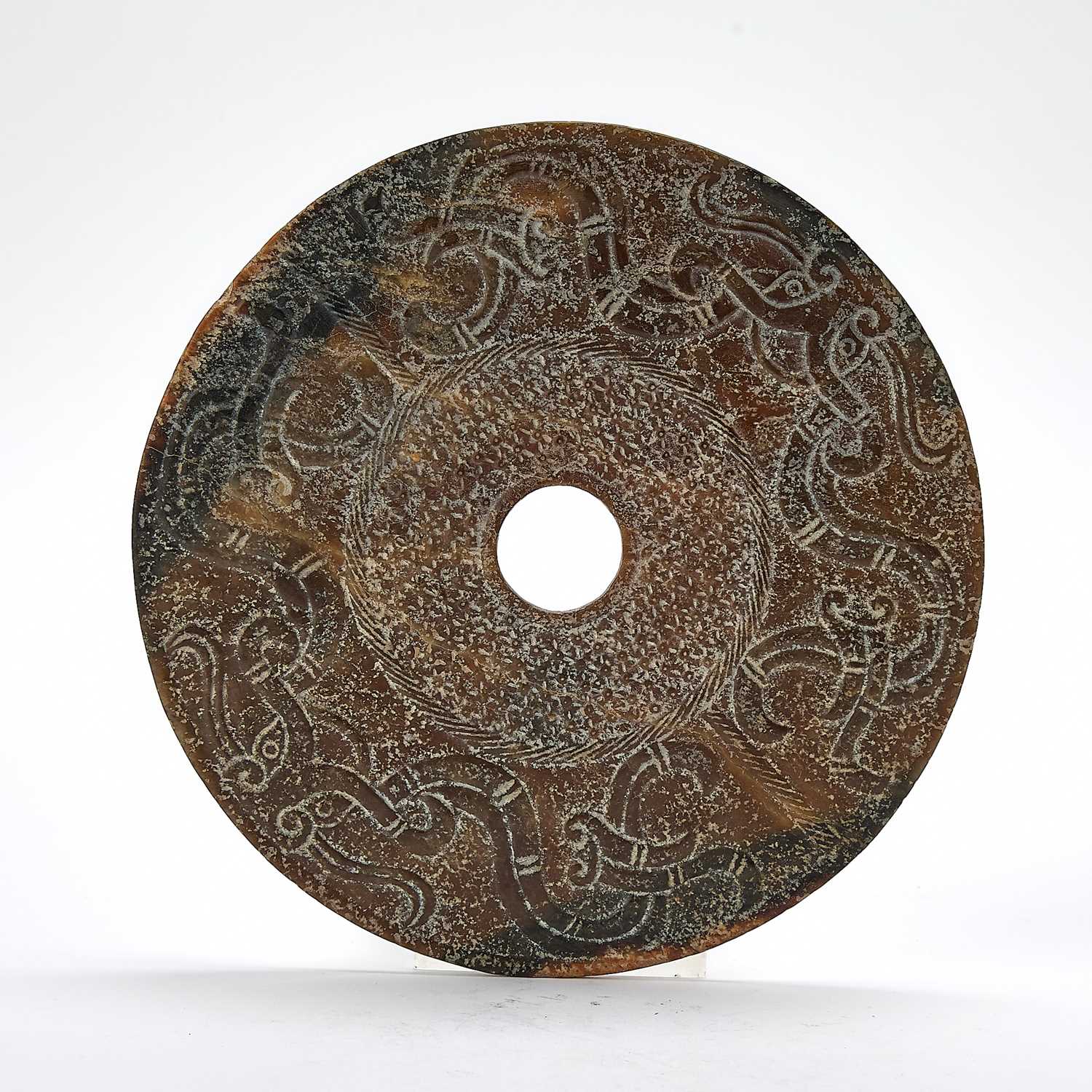 Lot 51 - A Chinese Jade Archaistic Bi Disc